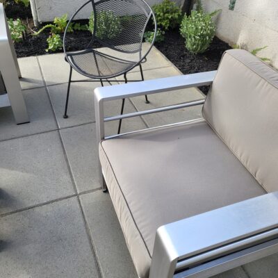 13 low main out concrete paving stones with metal furniture
