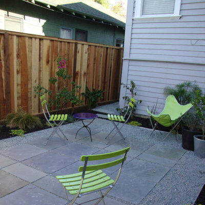 Natural stone and gravel patio lawn alternative plants only on edge saves water