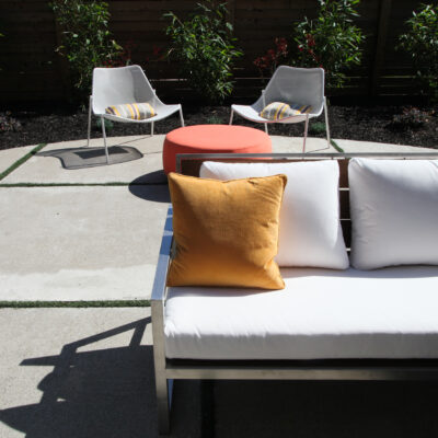 3 low main out room Old concrete gets new look with turf in cracks metal furniture