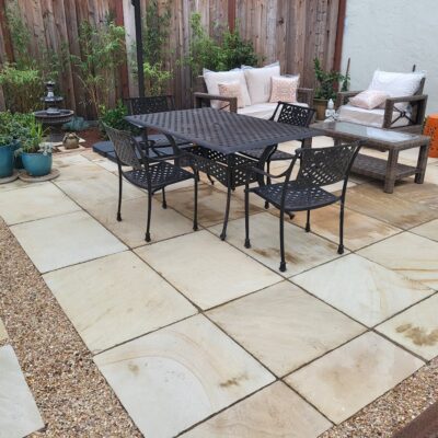 8 low main out room Hand cut and laid natural stone permeable patio with beach pebbles